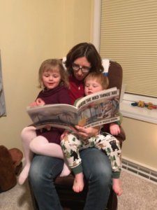 Mom reading with two children